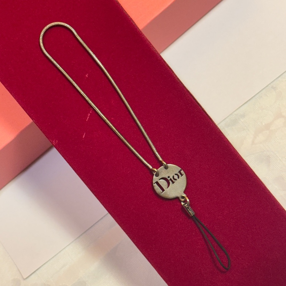 Dior Silver Case phone holder 
In decent condition Silver Dior Logo